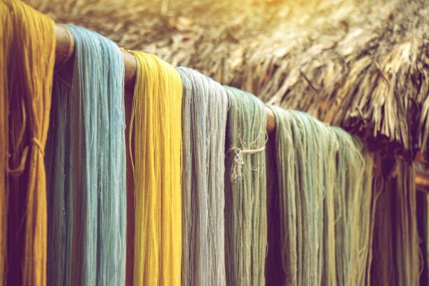 Bundles of yarn drying after being dyed with natural pigments.
